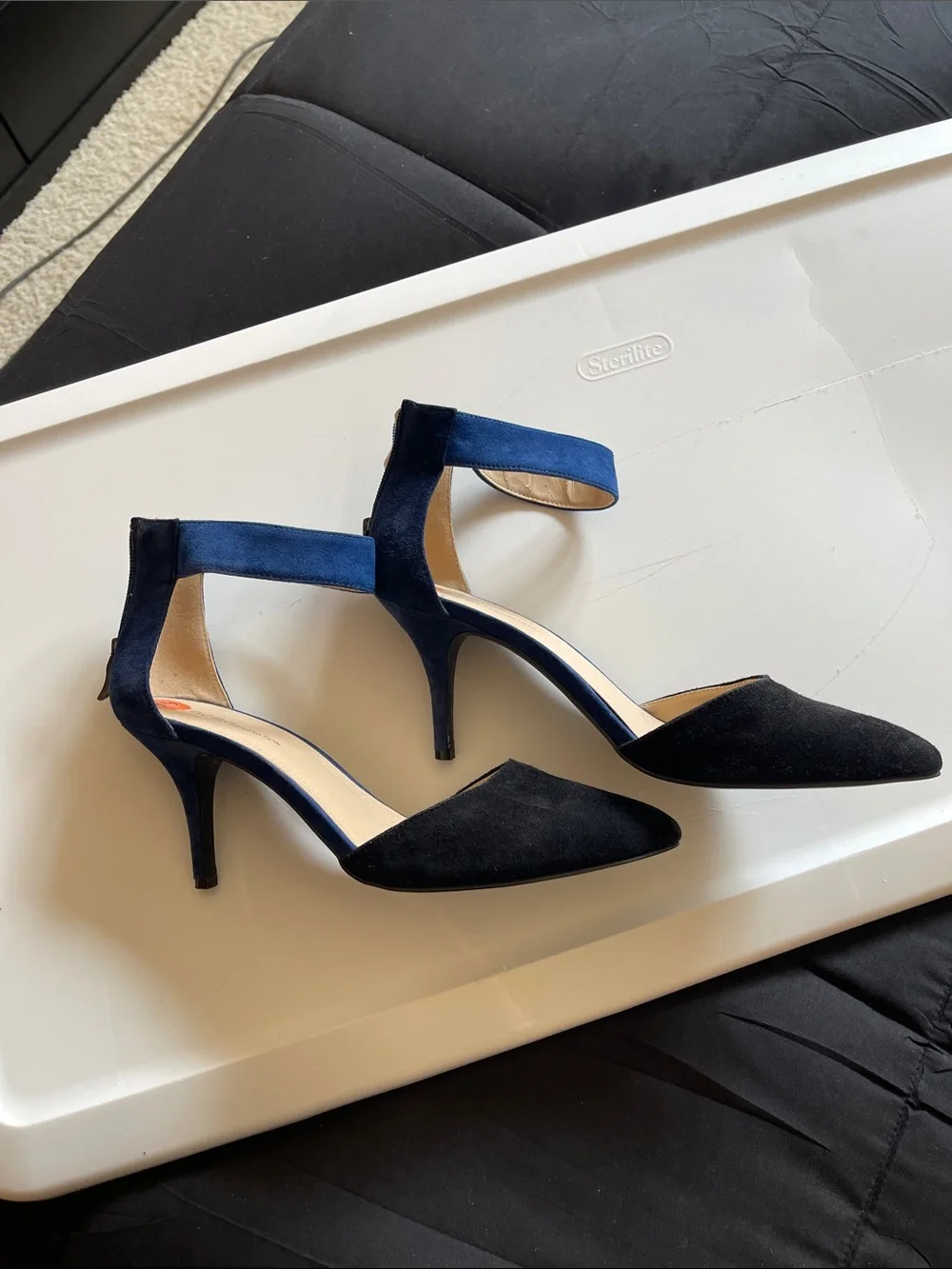 BCBGeneration Black Pointed-Toe Heels with Navy Ankle Strap